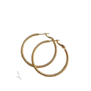 Minimalist gold twisted hoop earrings with a textured rope design for women