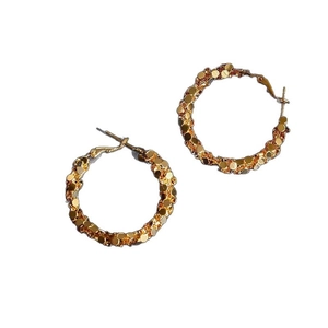 Chic oversized gold hoop earrings with sparkling sequins and trendy metallic texture