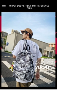 Outdoor street shot of a trendy manga print backpack with a green dinosaur charm