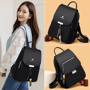 Sac à dos noir imperméable en nylon pour femme avec fermeture à cordon et zips métalliques