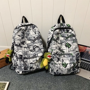Stylish anime manga print street style backpacks with cool neon green accents and charms