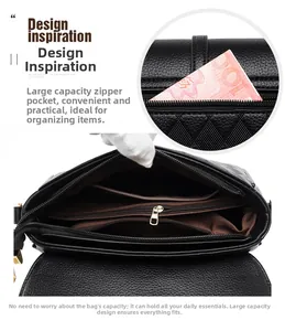 Detail view of large capacity black pebbled leather handbag with multiple compartments