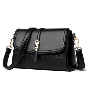Elegant black leather shoulder bag with diamond pattern and gold hardware on white background