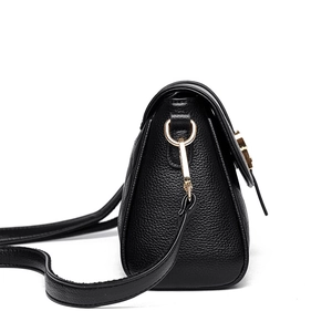 Elegant black lychee grain leather crossbody bag for women with gold hardware and flap