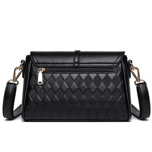 Classic black quilted leather crossbody bag with gold hardware and back zipper pocket