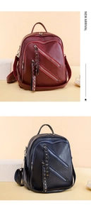 Detail view of burgundy and navy PU leather backpacks with stylish zipper and rivet accents