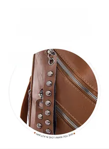 Detail of brown PU leather backpack with silver rivet tassel zipper puller design