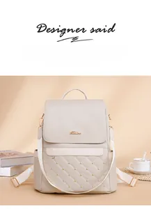 Detail of off-white quilted backpack with gold studs and side pocket for water bottle