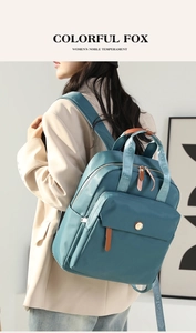 Side view of woman wearing stylish grey-blue nylon backpack for casual travel and fashion