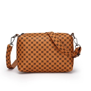 Fashionable brown leather crossbody bag with heart pattern print and adjustable strap