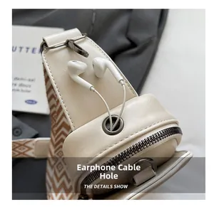 Detail view of the beige PU leather crossbody bag featuring a functional earphone hole design