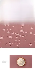 Close-up of water-resistant pink nylon fabric with brand logo badge and water droplets