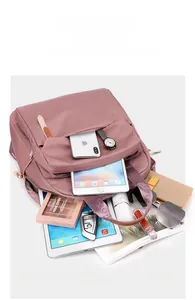Detail view of pink nylon backpack showing large capacity for A4 magazines and gadgets