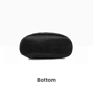 Detailed view of the black leather backpack base with diamond quilted stitching patterns