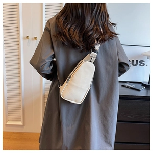 Back view of white PU leather crossbody chest bag with geometric jacquard strap