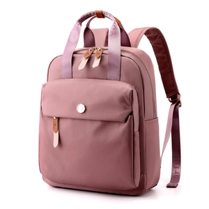 Pink nylon backpack for women featuring dual top handles and adjustable branded straps