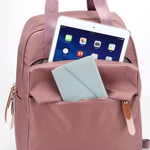 Nylon backpack in mauve pink with iPad storage and functional front pocket