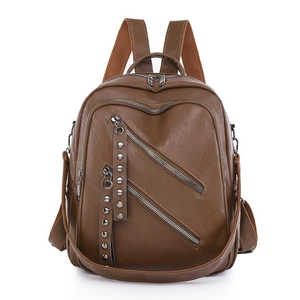 Brown PU leather backpack for women with decorative zippers and metallic rivets detail