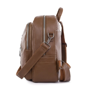 Brown PU leather backpack with three zipper compartments and adjustable straps side view