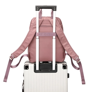 Waterproof nylon backpack in lotus pink with luggage strap and anti-theft back pocket
