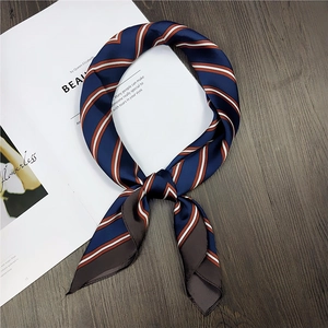 Elegant navy blue striped satin square scarf with premium silk texture on a chic background