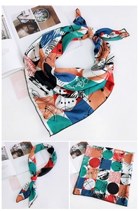 Dettagli del foulard di seta geometrico che mostra stili di annodatura e motivi astratti
