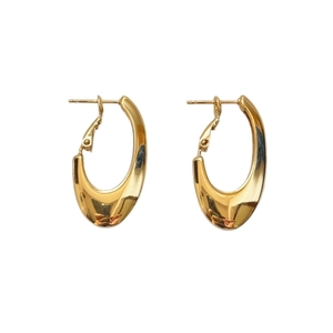 Minimalist gold oval hoop earrings with polished mirror finish and secure clasp closure