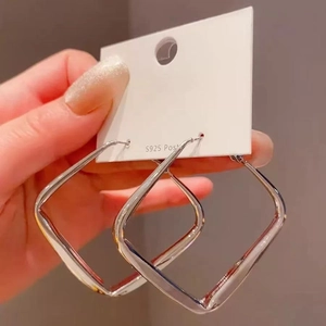 Macro shot of silver geometric square hoop earrings with S925 sterling silver posts