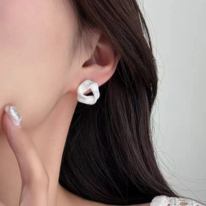 Boucles d'oreilles créoles torsadées géométriques minimalistes en argent texturé