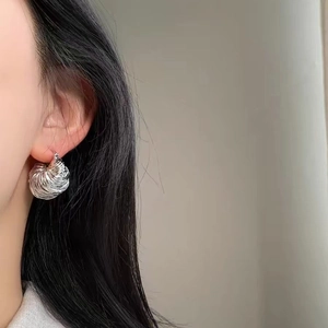 Elegant silver spiral ball earrings with high-shine metallic texture for women