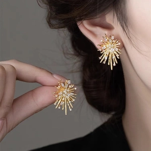 Elegant gold fireworks stud earrings with radiant zircon crystals for a minimalist style