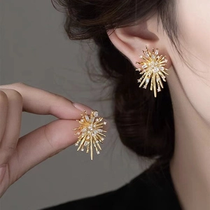 Elegant gold firework-inspired stud earrings featuring radiant zircon stones for women