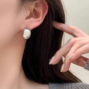 Polished silver bean stud earrings for women with minimalist oval metallic design