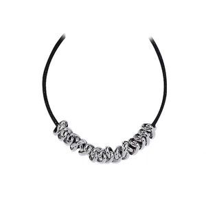 Minimalist black cord necklace featuring interlocking silver metal rings on a white background