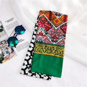 Detailed view of colorful tribal print silk scarf with ethnic geometric patterns