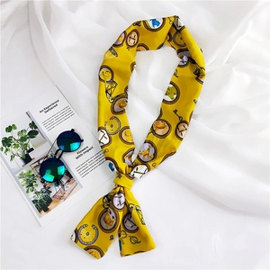 Detail of yellow silk scarf featuring astrological zodiac prints and celestial patterns