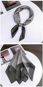 Close-up of a striped silk square scarf showing the gray and beige contrast details