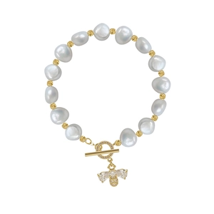 Baroque pearl bracelet featuring a gold bee charm with zircon inlays and toggle clasp