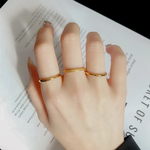 Detailed view of three-piece titanium steel rings set featuring polished and matte finishes
