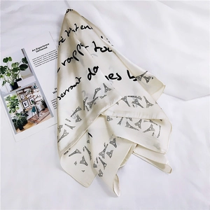 Detail of French style square silk scarf with Eiffel Tower and letter prints