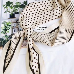 French style polka dot silk scarf in cream and brown with elegant knotted styling