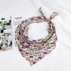 Pink triangle silk scarf with purple geometric print and elegant wavy edges shown tied