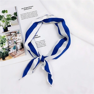 Detail of pre-knotted blue and white striped silk scarf showing fine edge stitching