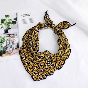 Detail of multi-color patterned silk scarf with wavy edges and vintage leaf print