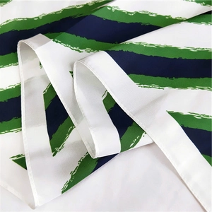 Detail of artistic striped silk scarf showing brushstroke texture and fine hemmed edges