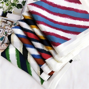 Multiple striped silk-feel square scarves for women displayed in various color palettes