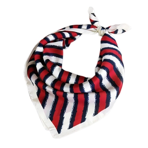 Elegant red white and blue striped square silk scarf tied in a stylish knot on white background