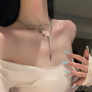 Double-layer silver titanium steel necklace featuring coffee bean chain and long tassel