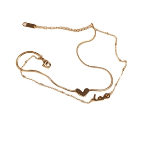 Gold double-layer anklet featuring heart pendant and LOVE lettering on white background