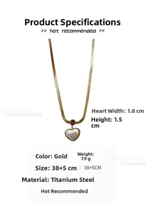 Detail of gold titanium steel snake chain with engraved love heart pearl pendant